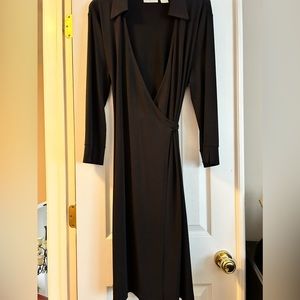 Beautiful and sexy black wrap around dress. Appx. 42 inches long.